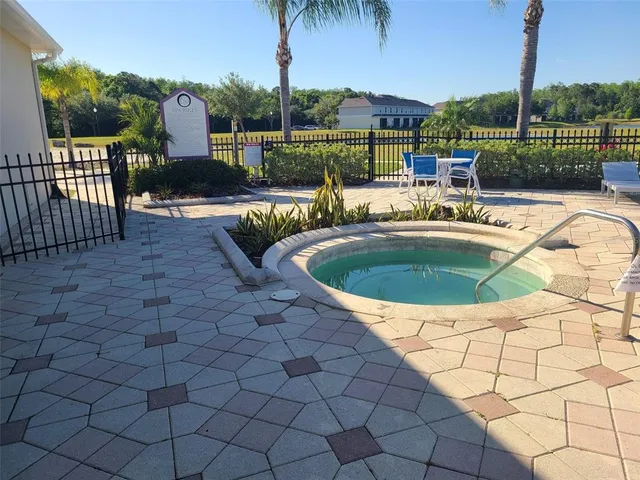 swimming pool view with a garden space