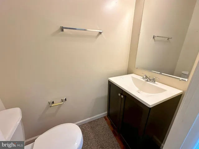 a bathroom with a sink toilet and vanity