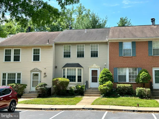 a aerial view of a house with a yard and plants
