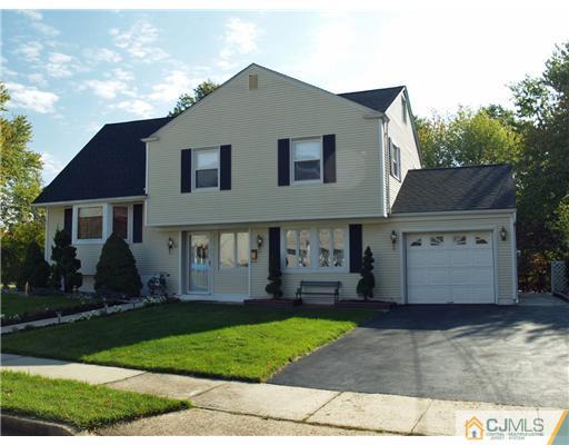 21 Phillips Road Edison, NJ 08817 - Photo 1 of 10 a front view of a house with a yard and a garage