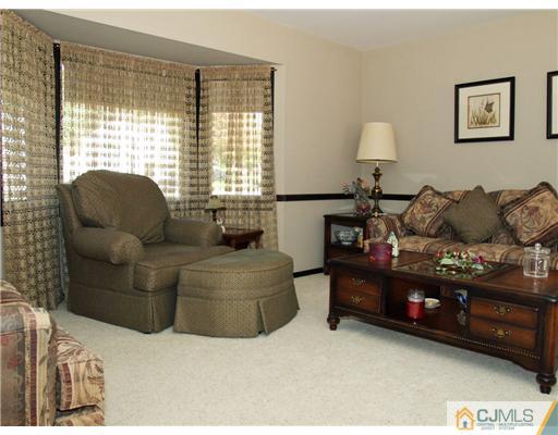 21 Phillips Road Edison, NJ 08817 - Photo 2 of 10 a living room with furniture and a window