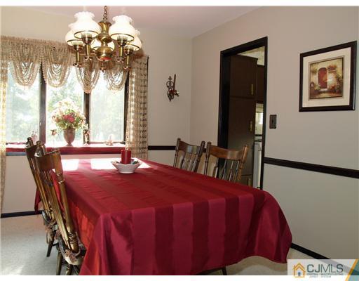 21 Phillips Road Edison, NJ 08817 - Photo 3 of 10 a dining room with furniture and chandelier
