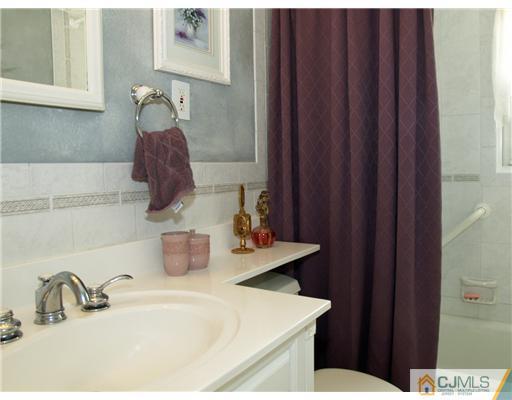 21 Phillips Road Edison, NJ 08817 - Photo 8 of 10 a bathroom with a sink and a toilet