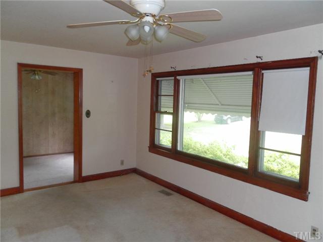 3032 Ross Road Durham, NC 27703 - Photo 5 of 11 a view of an empty room with a window