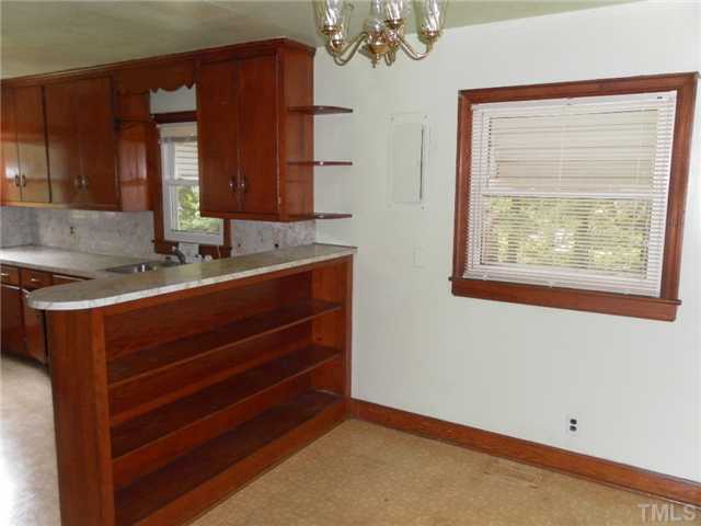3032 Ross Road Durham, NC 27703 - Photo 6 of 11 a bathroom with a sink and a mirror