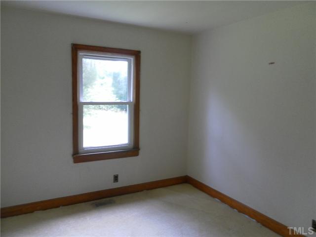 3032 Ross Road Durham, NC 27703 - Photo 10 of 11 an empty room with a window