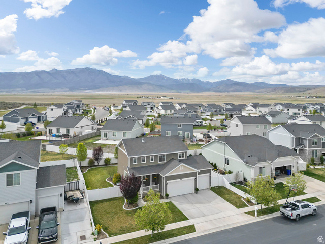 7685 Timber Country Road Eagle Mountain, UT 84005 - Photo 37 of 39 Aerial overview of a residential neighborhood with distant mountain ranges