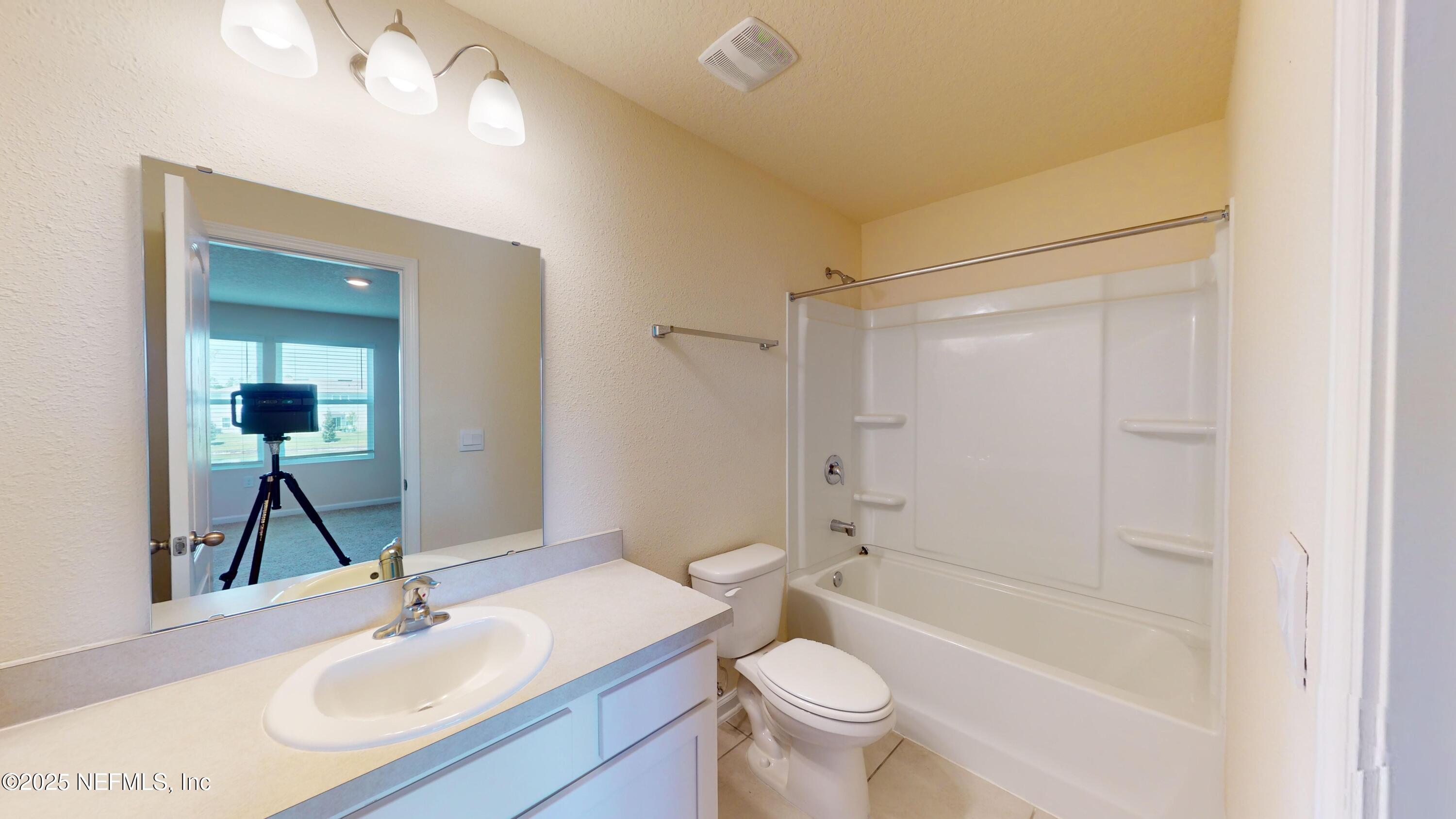 67 Oarsman Xing Drive St. Augustine, FL 32095 - Photo 14 of 33 a bathroom with a sink toilet and shower
