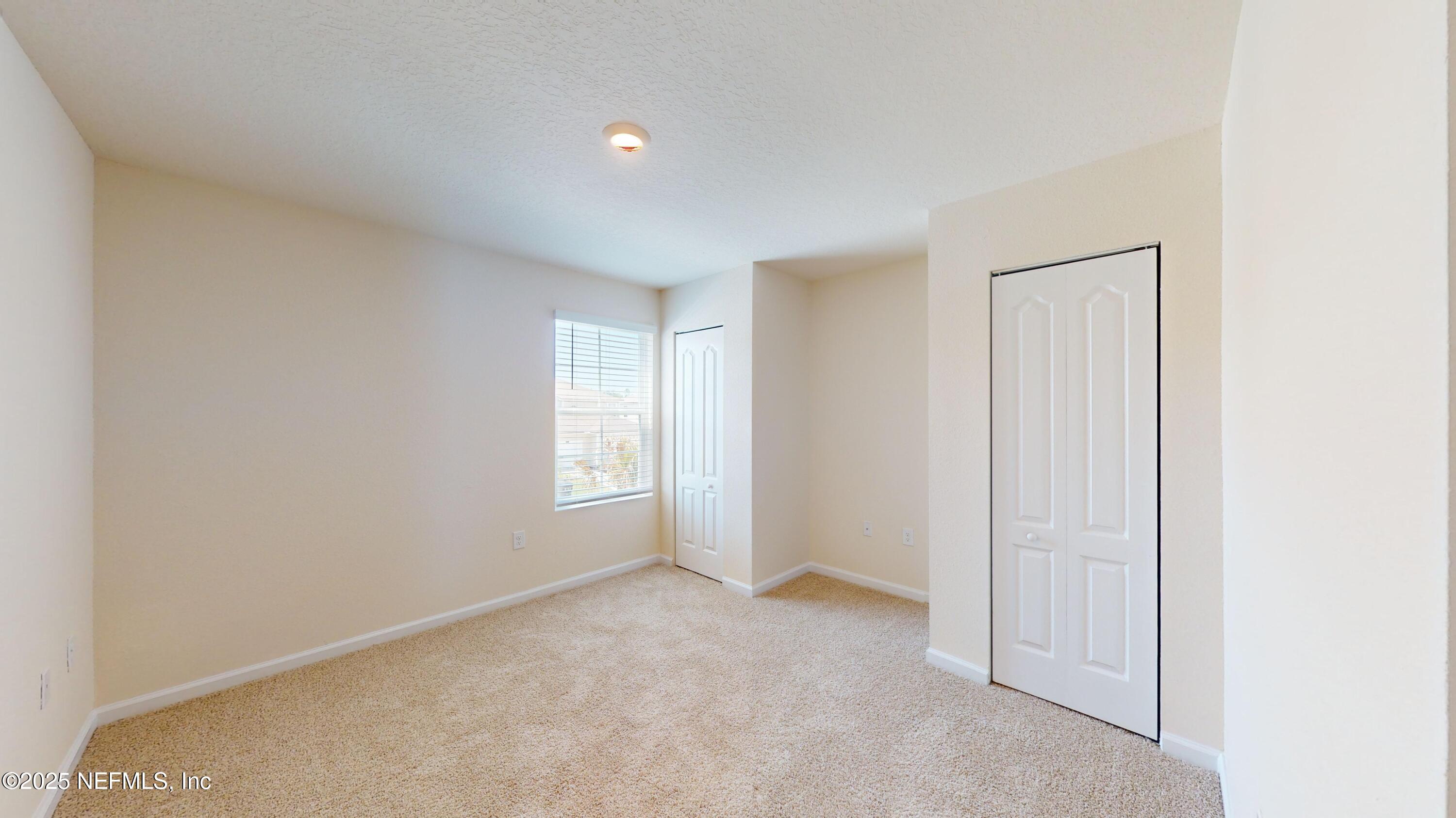 67 Oarsman Xing Drive St. Augustine, FL 32095 - Photo 18 of 33 a view of an empty room and a window