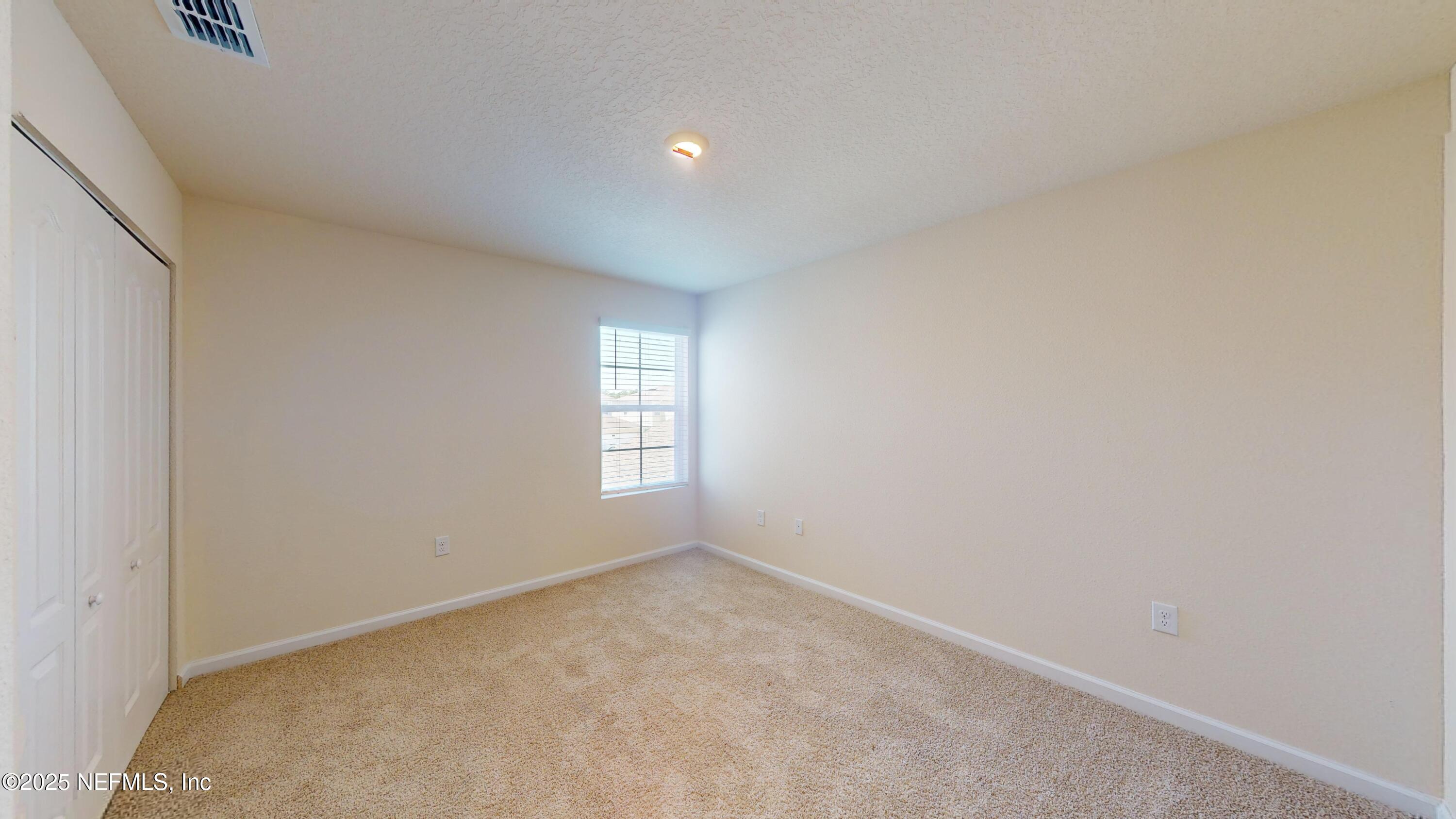 67 Oarsman Xing Drive St. Augustine, FL 32095 - Photo 19 of 33 a view of an empty room with a window