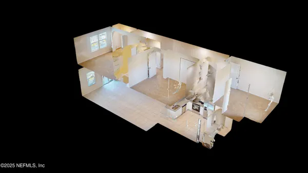 an aerial view of a house with swimming pool garden and patio