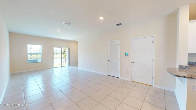 a view of an empty room with windows