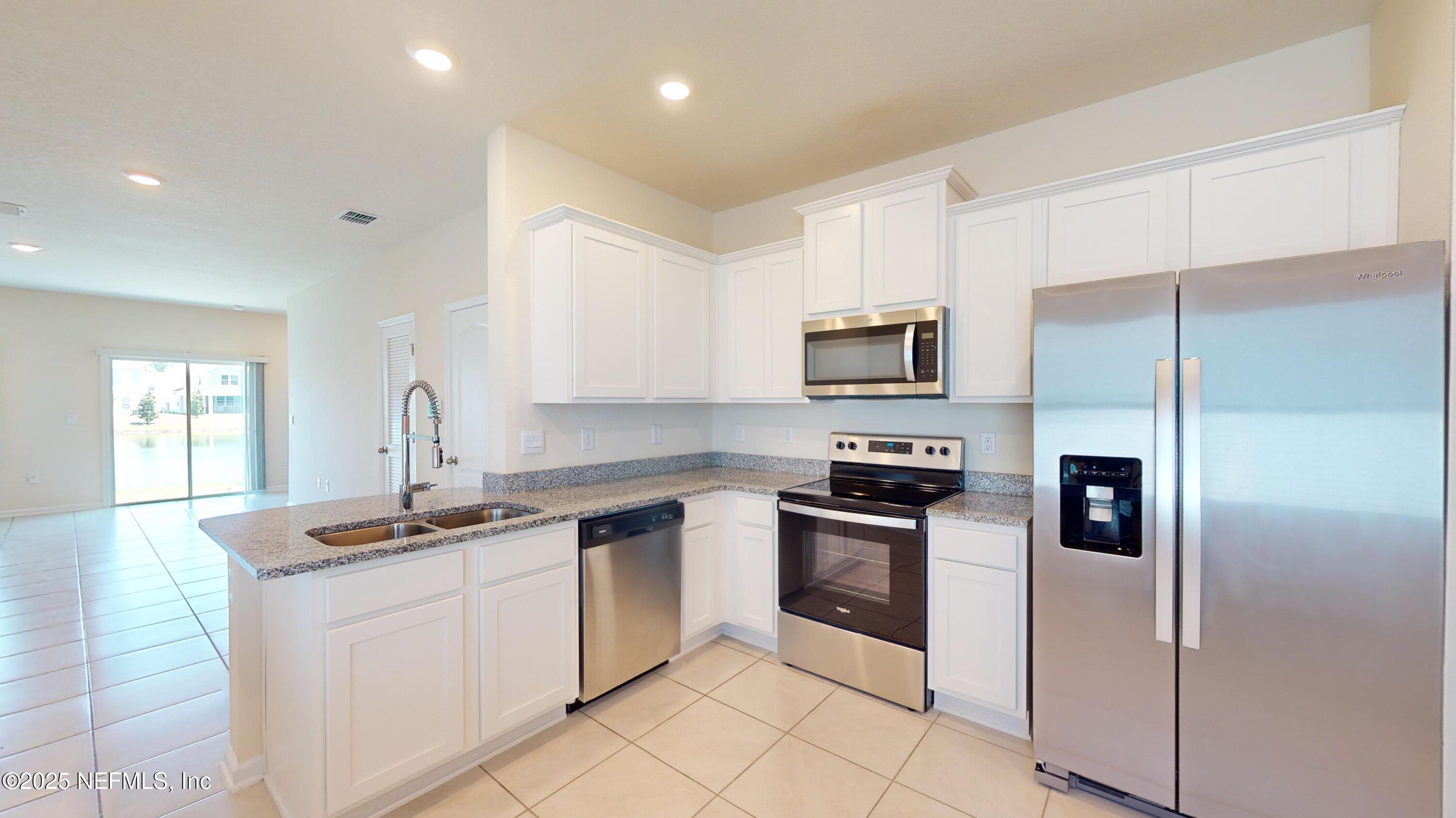 67 Oarsman Xing Drive St. Augustine, FL 32095 - Photo 7 of 33 a kitchen with a sink appliances and cabinets