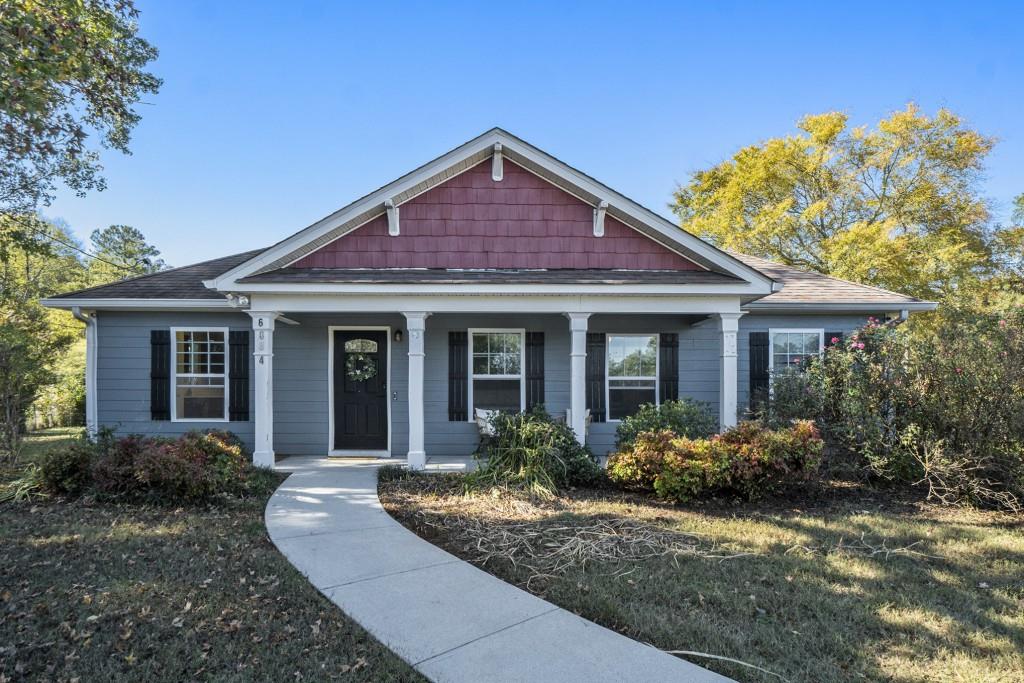 6084 South Gordon Road Southwest Austell, GA 30168 - Photo 1 of 1 a front view of a house with garden