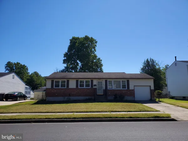a view of swimming pool in front of house