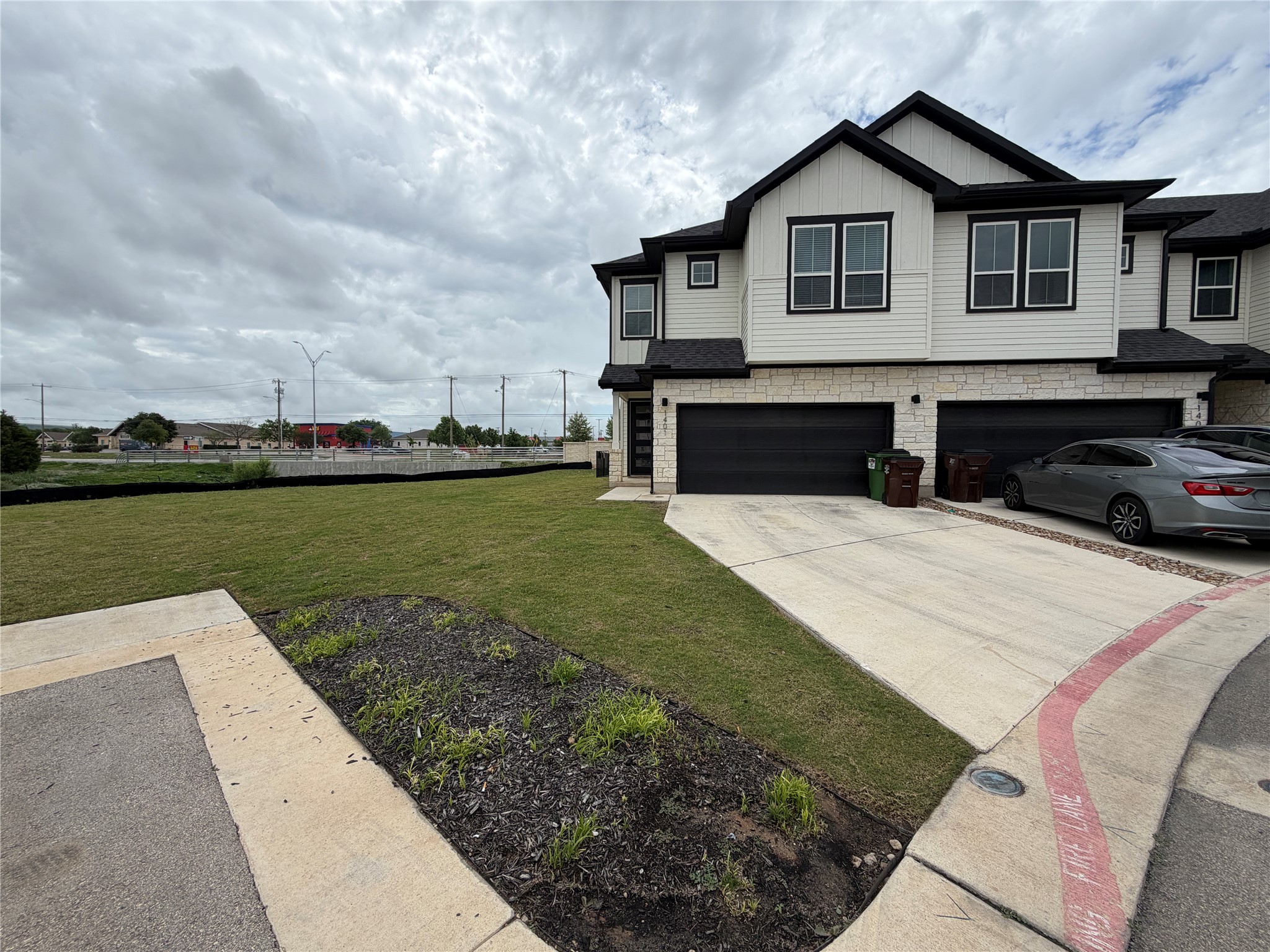 a view of a house with swimming pool and a yard