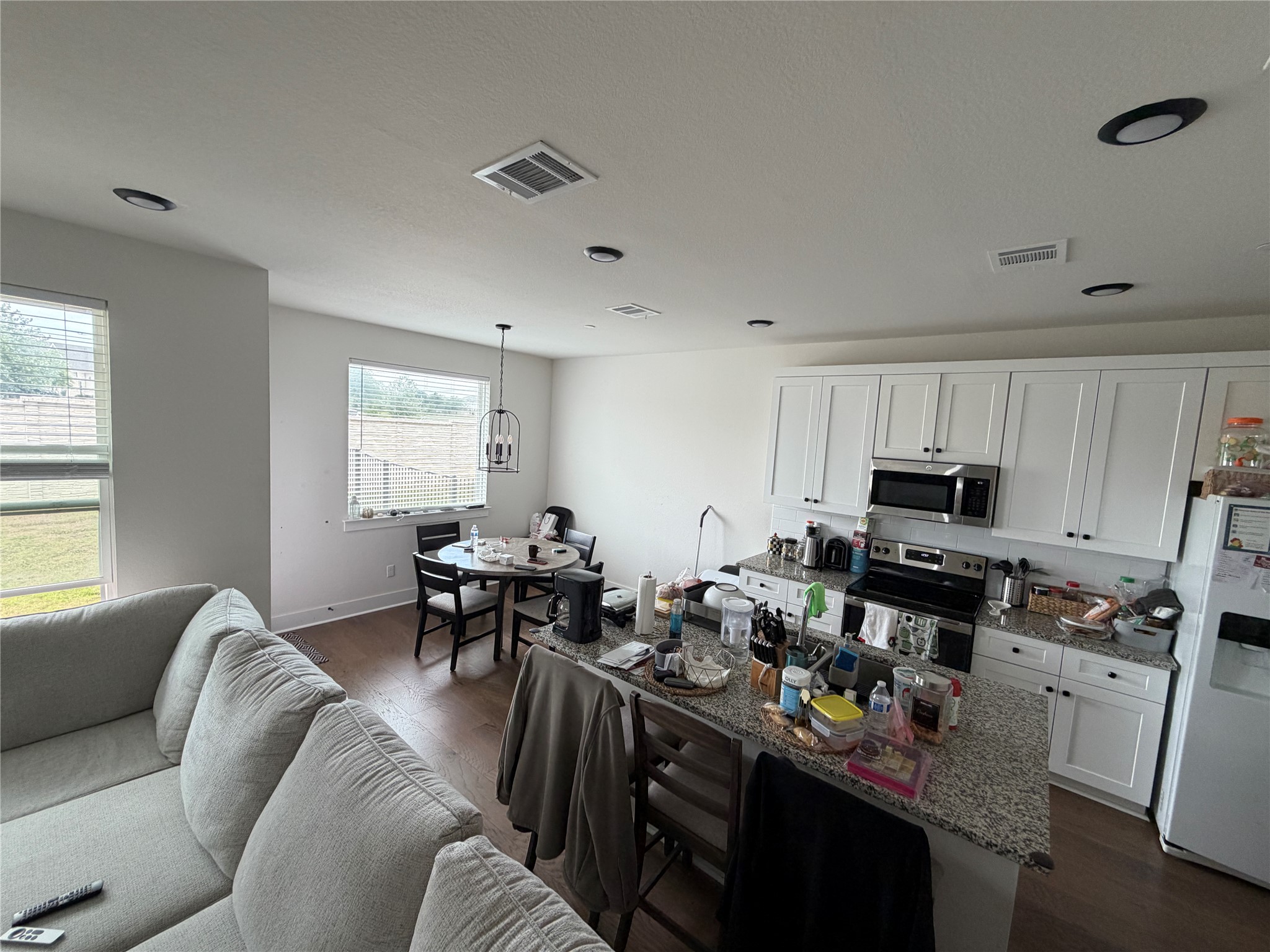2600 Gattis School Road, Unit 1401 Round Rock, TX 78664 - Photo 21 of 33 a living room with furniture a window and a dining table