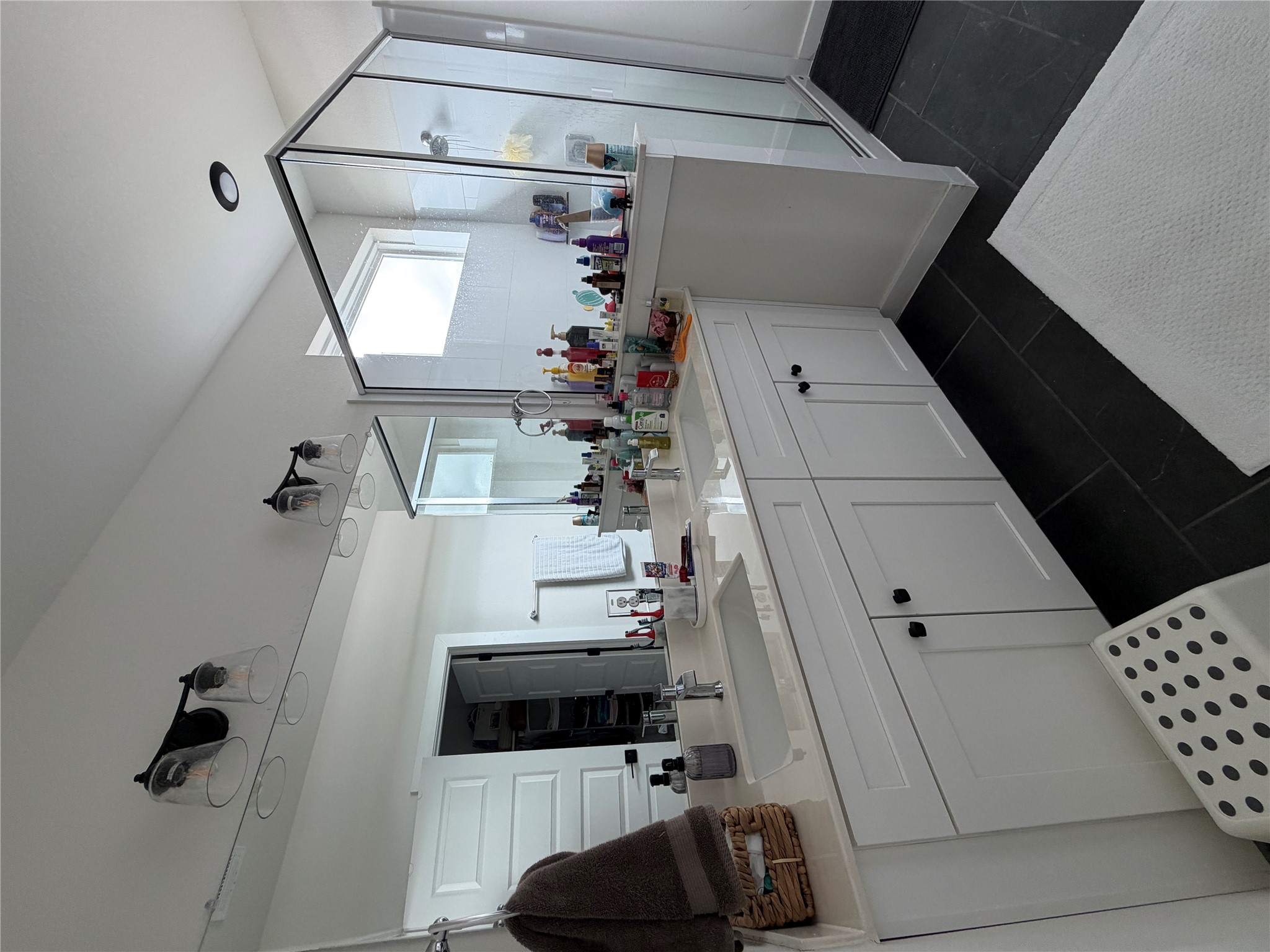 2600 Gattis School Road, Unit 1401 Round Rock, TX 78664 - Photo 26 of 33 a spacious bathroom with a double vanity sink a mirror a and a window