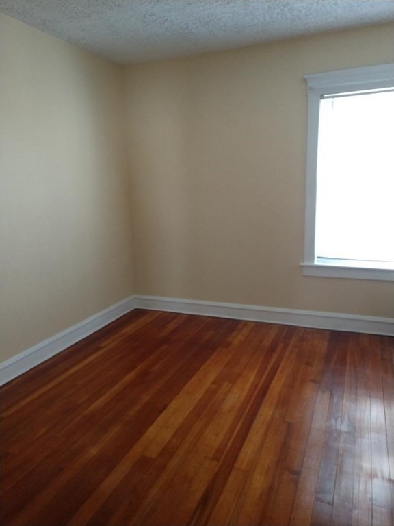 362 Pearce Street, Unit 2 Fall River, MA 02720 - Photo 19 of 24 a view of a room with wooden floor and window