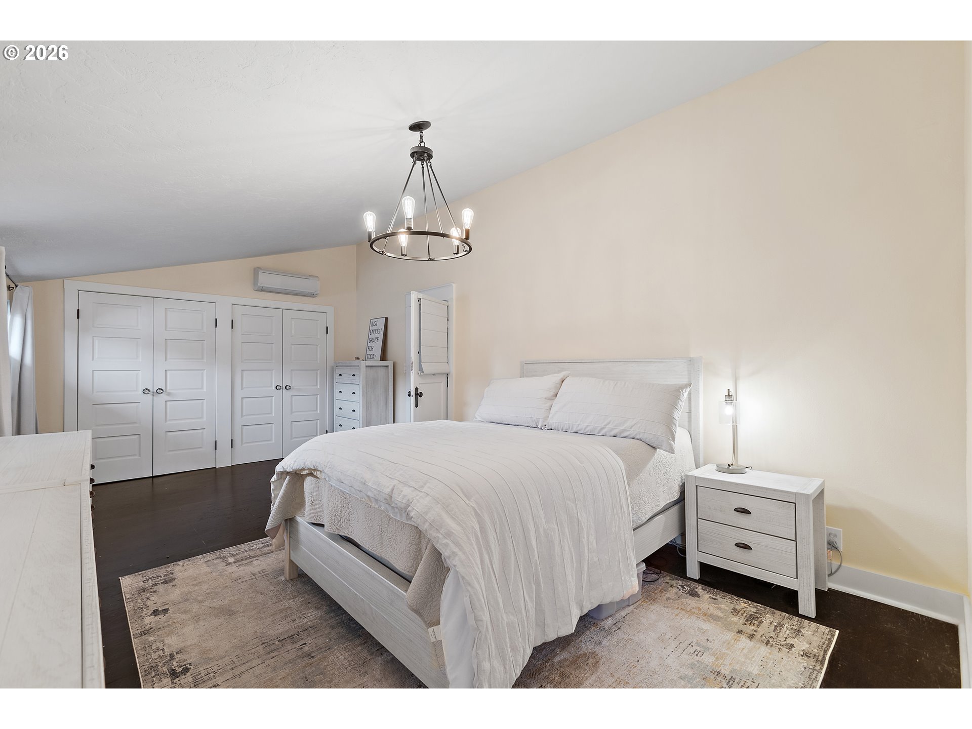 36937 Highway 213 Mount Angel, OR 97362 - Photo 18 of 43 a bedroom with a bed a chandelier and a dresser