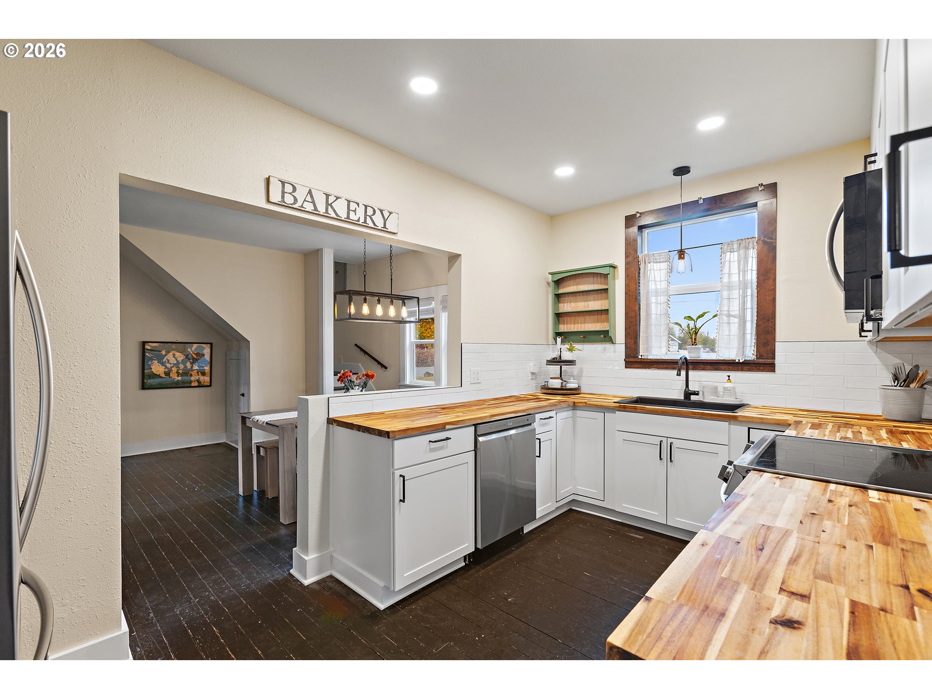 36937 Highway 213 Mount Angel, OR 97362 - Photo 10 of 43 a large kitchen with kitchen island a sink stainless steel appliances and cabinets