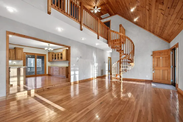 a living room with a fireplace and a fireplace