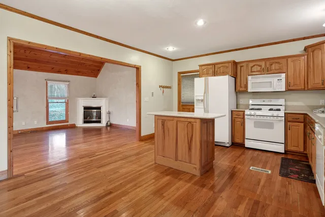 a bathroom with a sink toilet a mirror and shower
