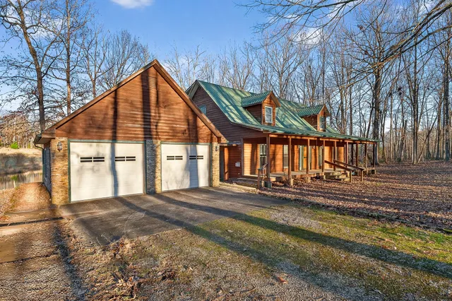 a view of a house with wooden fence