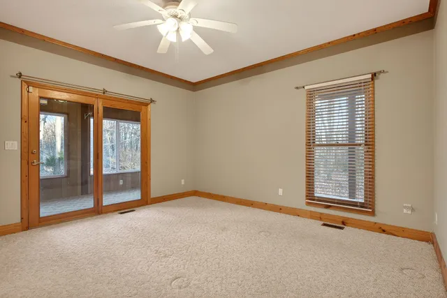 a view of an empty room with a window