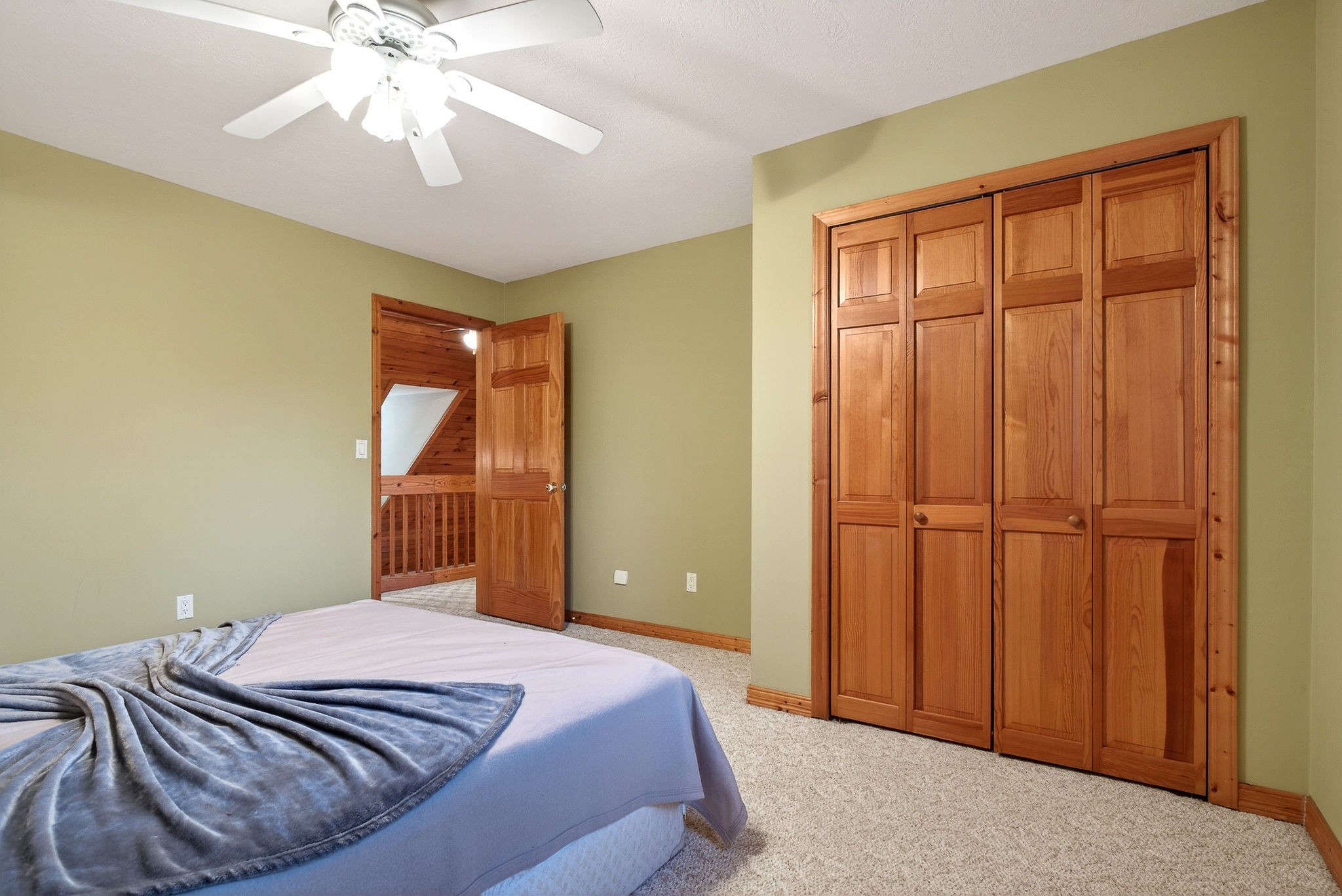 1011 Low Gap Road Sparta, TN 38583 - Photo 38 of 76 a bedroom with a bed and a chandelier