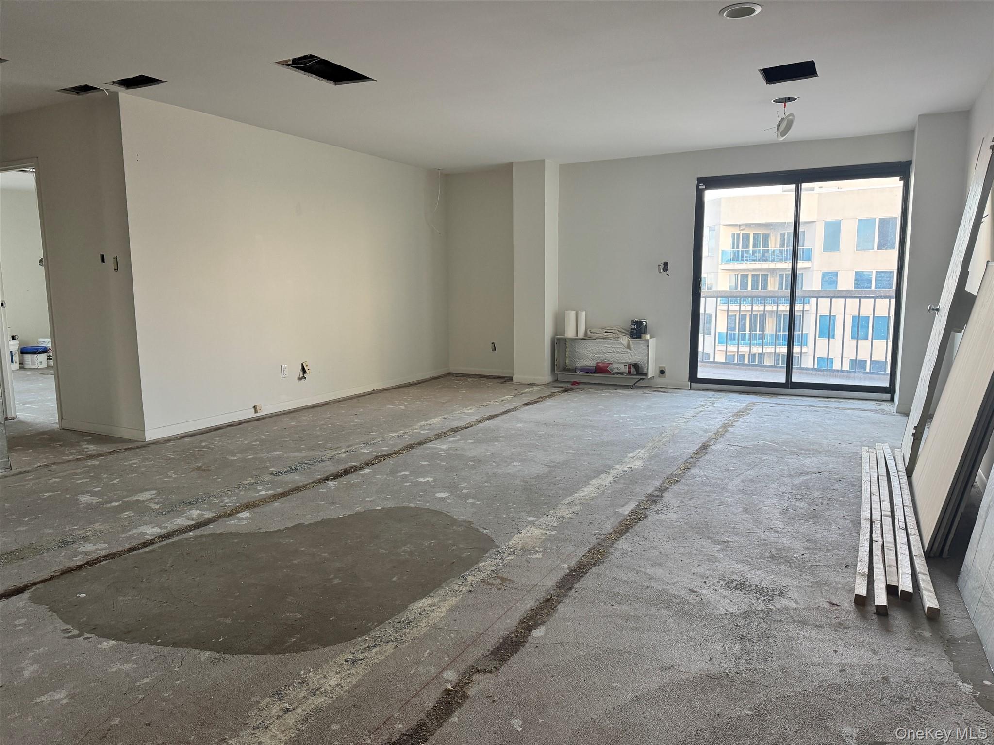 360 Shore Road, Unit 8L Long Beach, NY 11561 - Photo 13 of 21 an empty room with windows