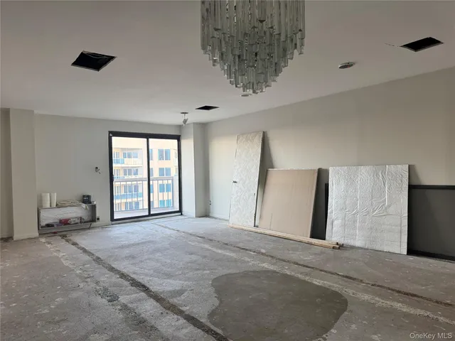 a view of a livingroom with a ceiling fan and window