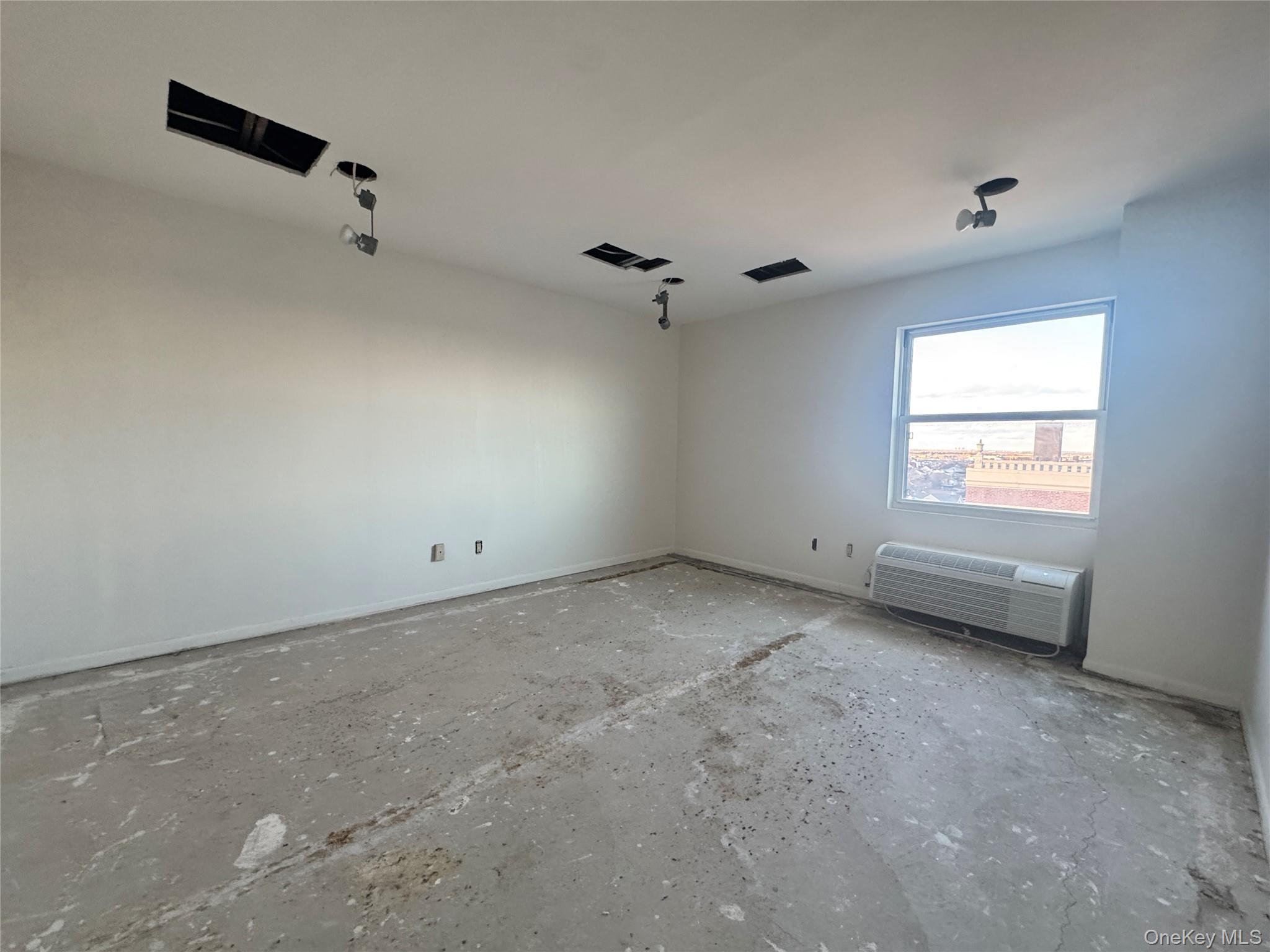 360 Shore Road, Unit 8L Long Beach, NY 11561 - Photo 18 of 21 an empty room with a window
