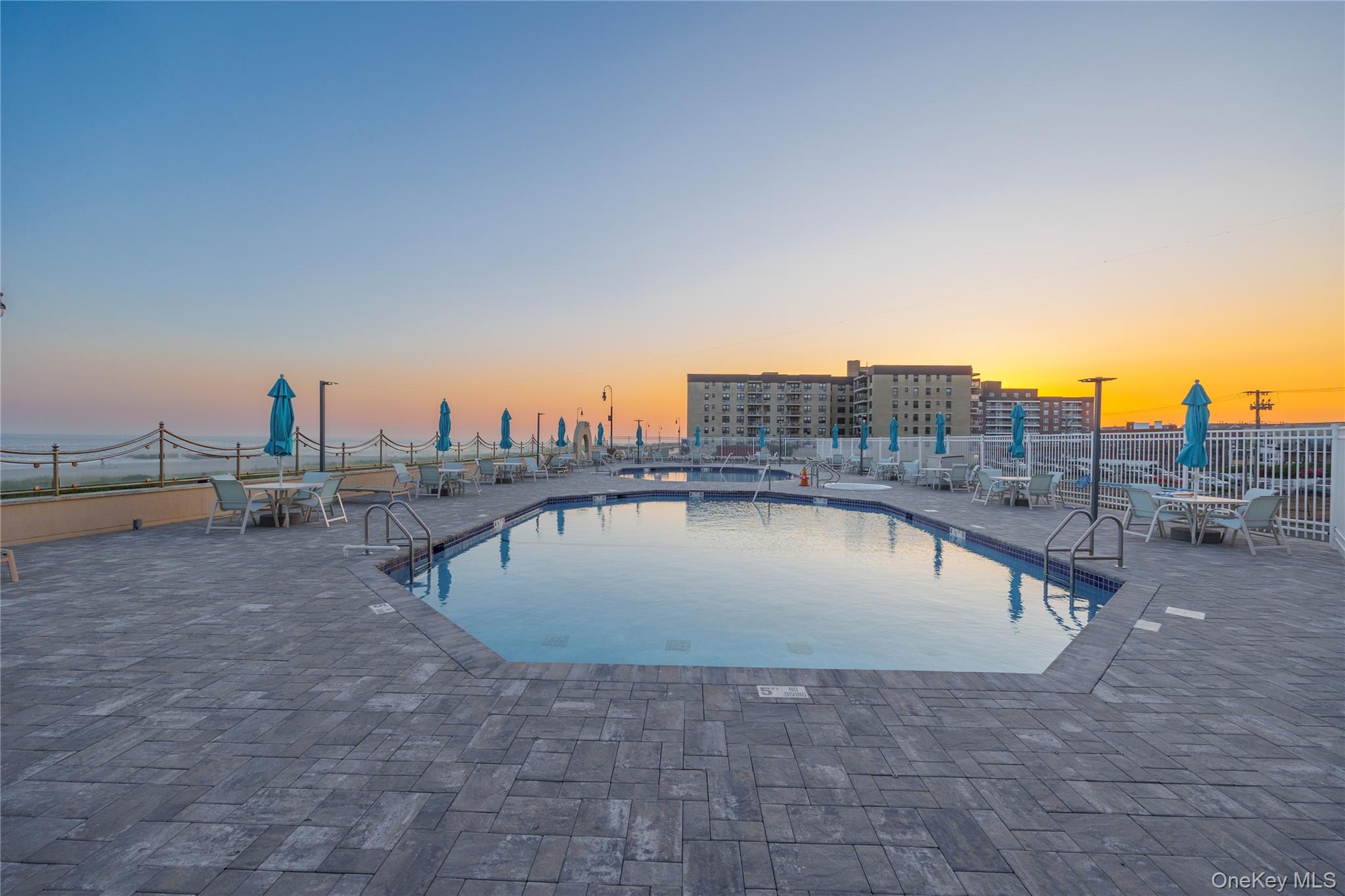 360 Shore Road, Unit 8L Long Beach, NY 11561 - Photo 4 of 12 a view of a swimming pool with a terrace