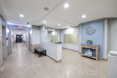 a view of a lobby with potted plants