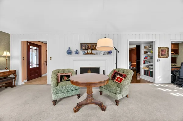 a large kitchen with stainless steel appliances granite countertop a refrigerator a stove and a wooden floor