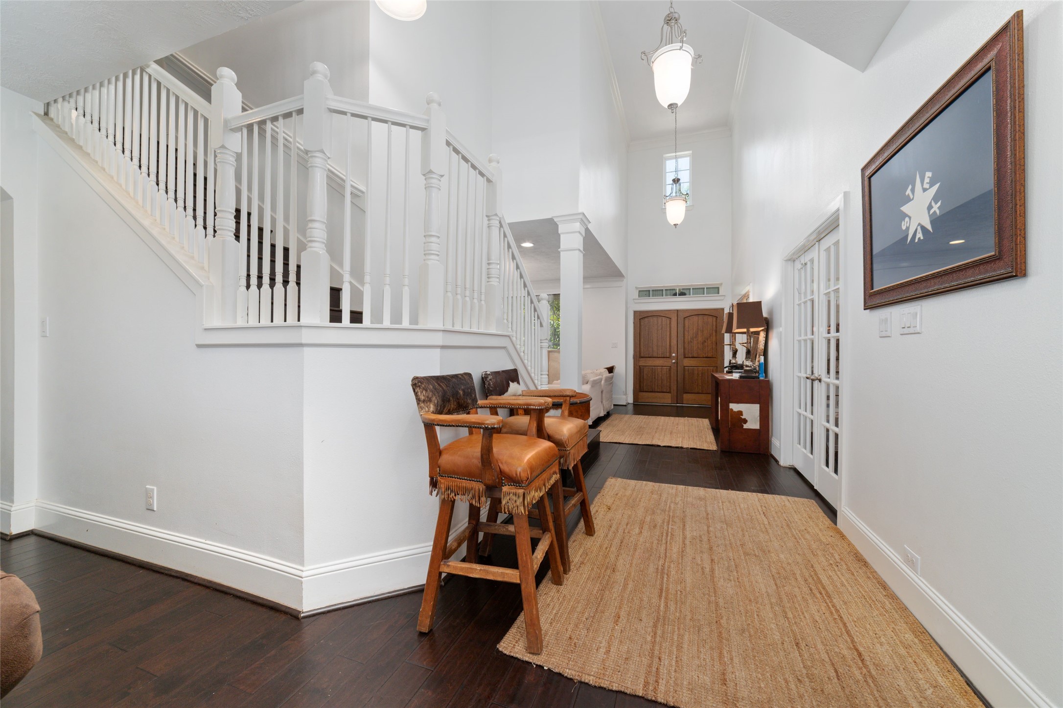 335 Voss Road Houston, TX 77024 - Photo 25 of 45 a view of a hallway with furniture and staircase