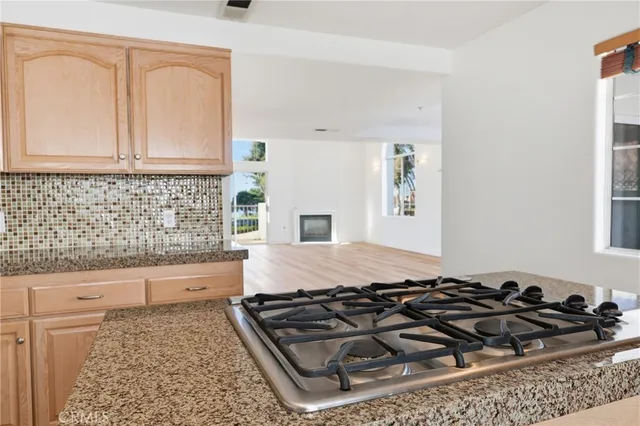 a bathroom with a granite countertop sink and a stove