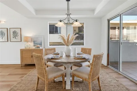 a view of a balcony with flower plants