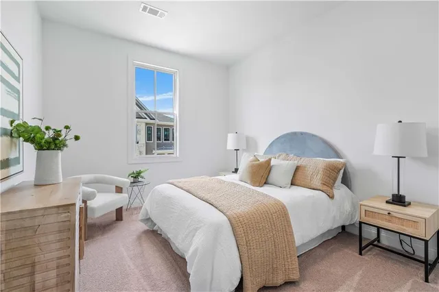 a bedroom with a bed and a table