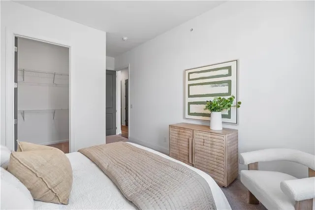 a bedroom with a bed and a couch