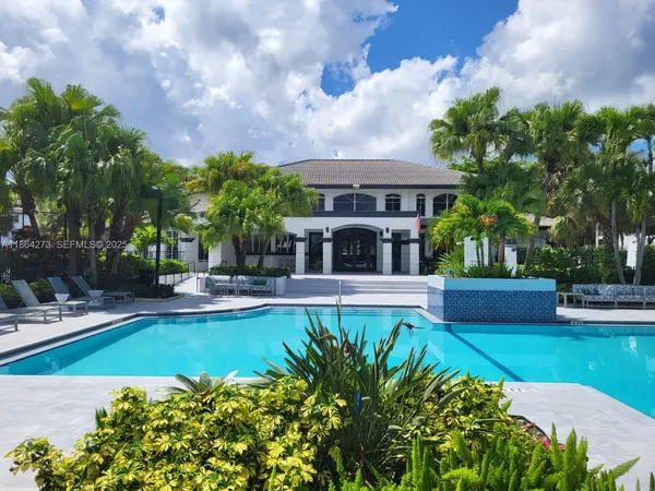 a view of a house with swimming pool garden and patio