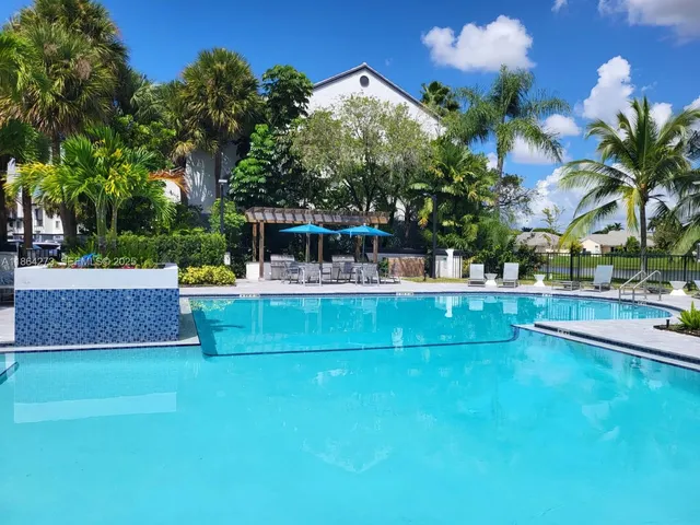 a living room with furniture and flat screen tv