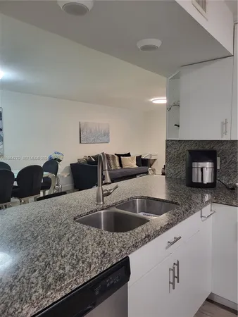 a utility room with sink dryer and washer