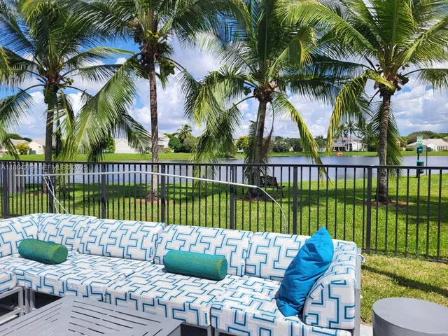 a bedroom with a bed and a flat tv screen on dresser