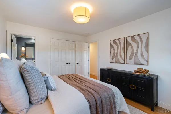 a bedroom with a bed and cabinets