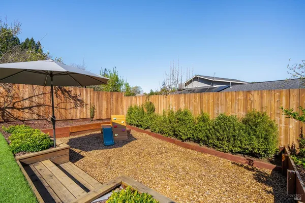a view of a house with a yard and plants