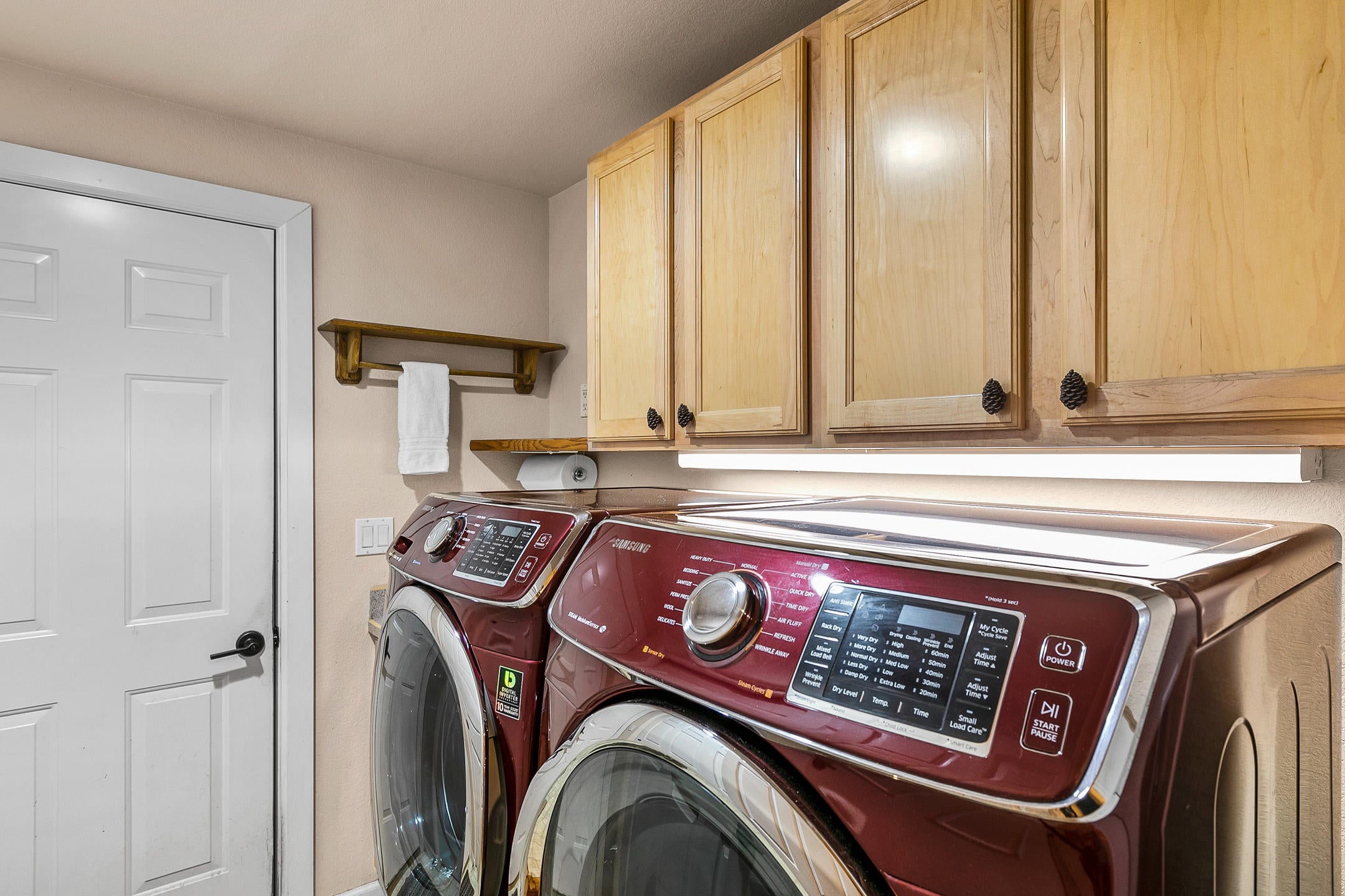 19175 Kiowa Road Bend, OR 97702 - Photo 22 of 44 Laundry room has sink and additional closet to the left in addition to those cabinets.