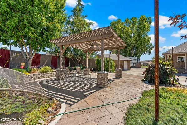 a view of a garden with a building in the background