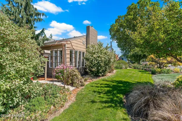 a view of a street with a building in the background